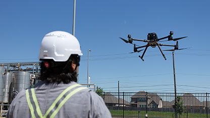 Drone hovering near pilot