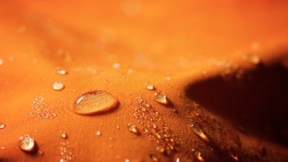Close-up of the fabric of a waterproof mountain jacket.