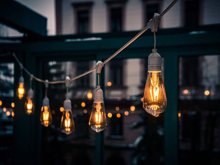 Stylish Edison light bulbs hanging from a cord in a cafe